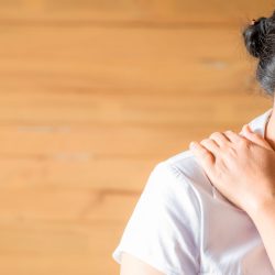 Woman feeling exhausted and suffering from neck pain. Woman feeling exhausted and suffering from neck pain. Health-care concept